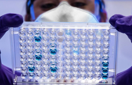 Blog Main Image - Researcher Woman Examining Samples Blue