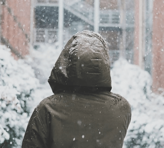 Blog Main Image - Woman Facing Snowy City