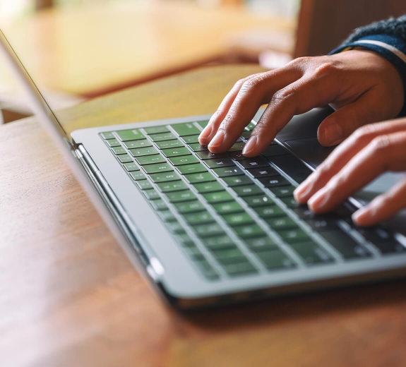 Featured Typing on Laptop Keyboard