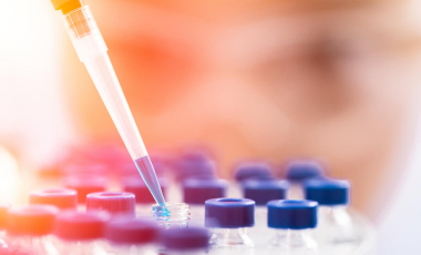 Blog Researcher Woman Pipetting Samples Blue