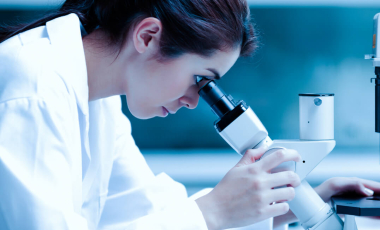 Blog Researcher Woman Using Microscope Lab